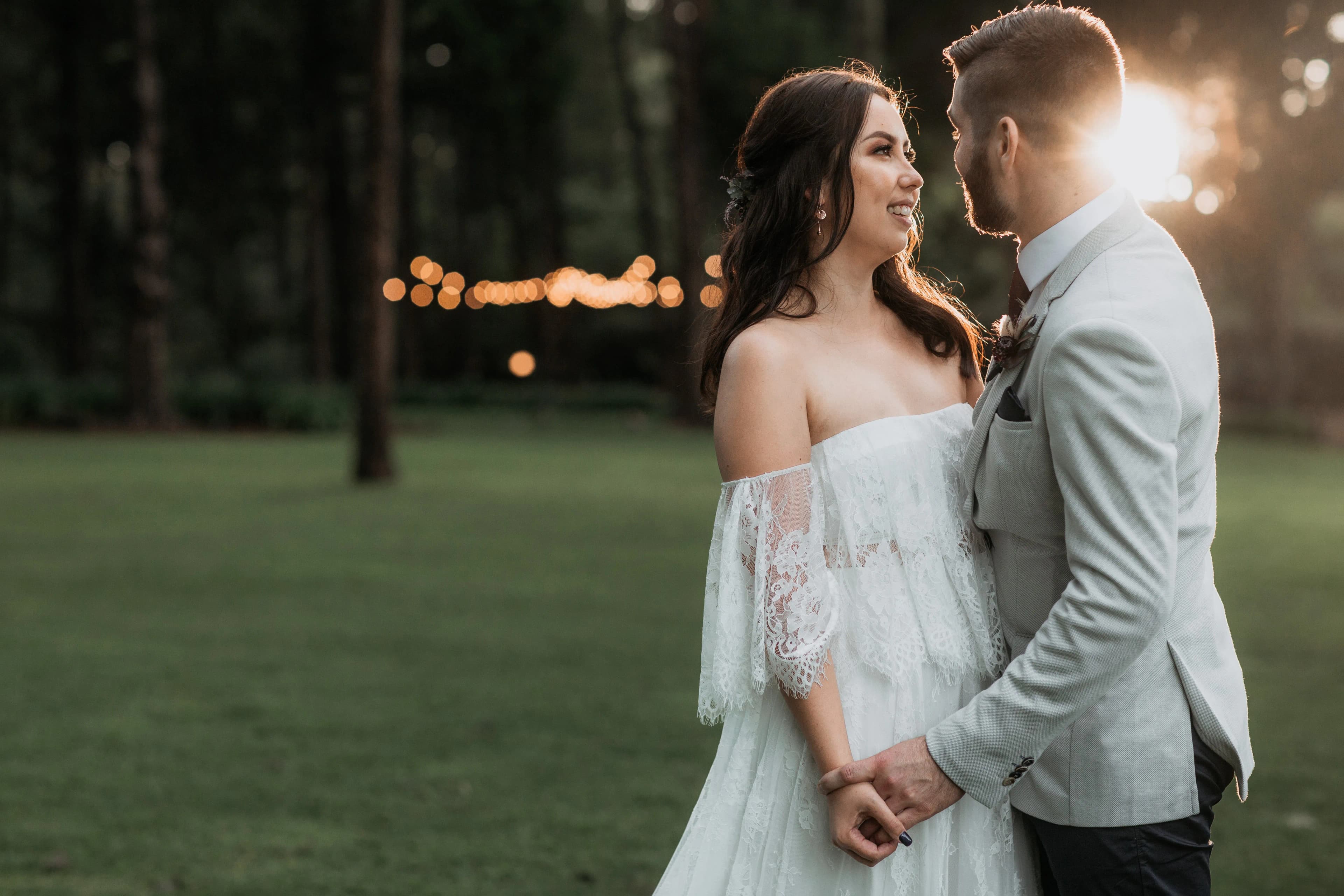 a happy couple looking into each other's eyes as they embrace on their wedding day