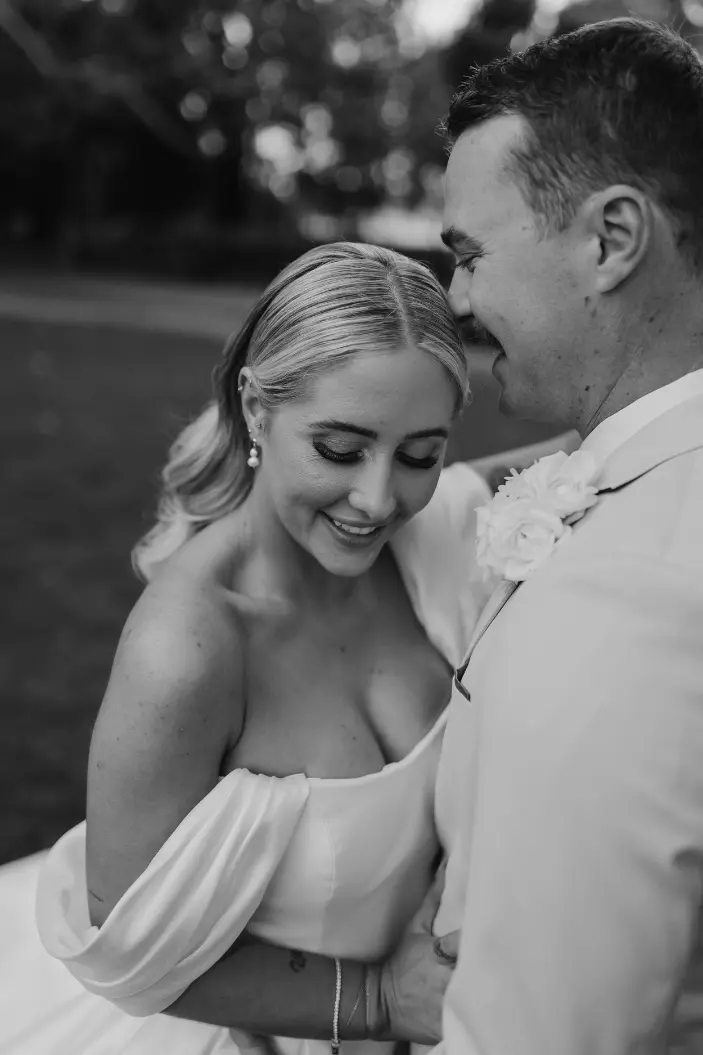 a bride and groom hugging in the Gabbinbar grounds